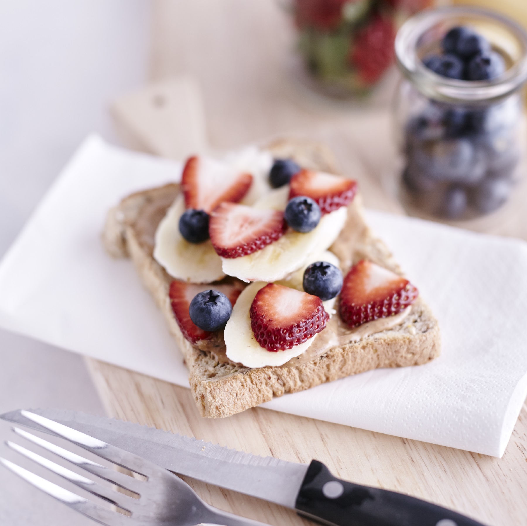 quick and easy nut butter toast recipe with fruit and bakers delight wholemeal bread