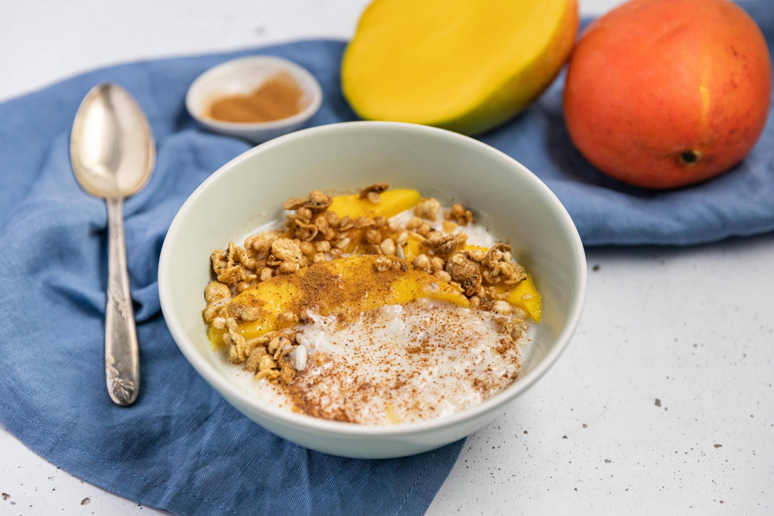 Creamy Coconut Rice Pudding with Mango & Maple Granola